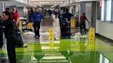 Bright green liquid gushes from ceiling at Miami International Airport on July 4