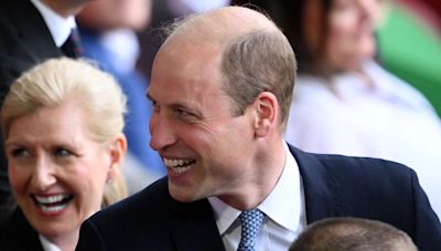 Prince William Has Hilarious Reaction to 'Cheesy' Sign with a Royal Twist in the Crowd at Soccer Game