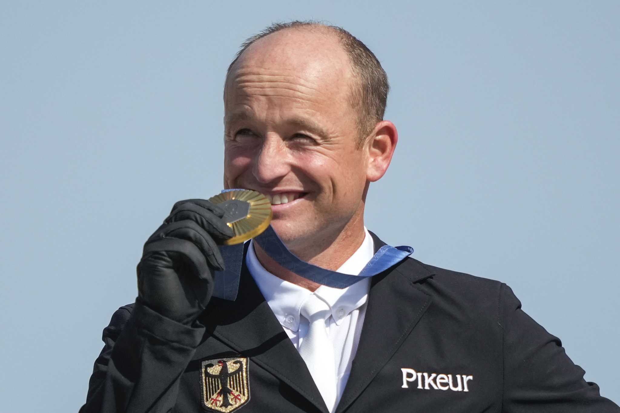 Michael Jung of Germany wins a record third Olympic equestrian gold medal in individual eventing