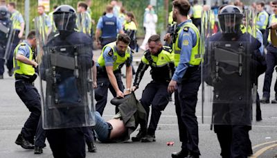 Protesters attack police and set fires outside Dublin asylum seeker site