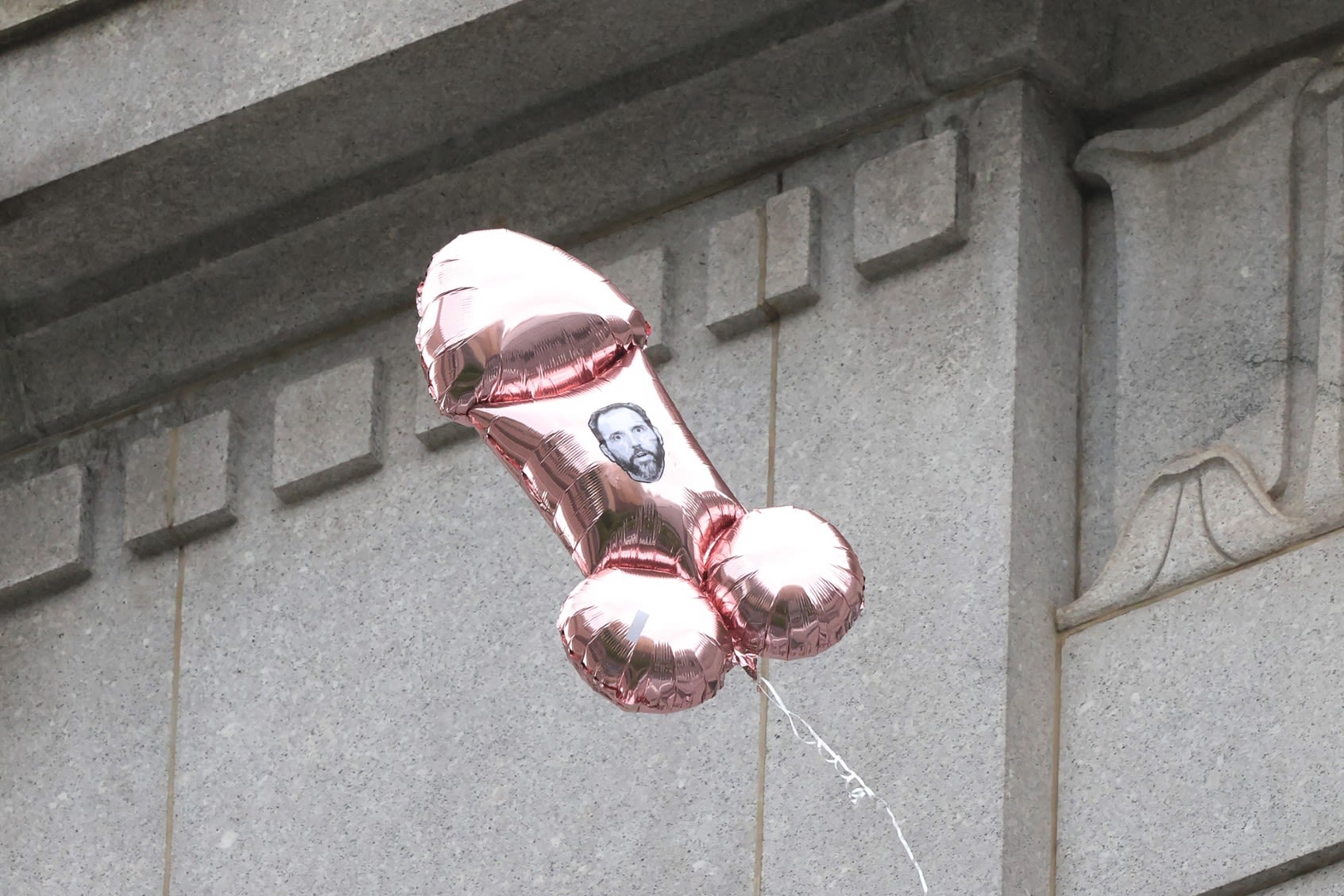 Phallic balloons and GOP allies: MAGA mobilizes as Cohen testimony comes to a close