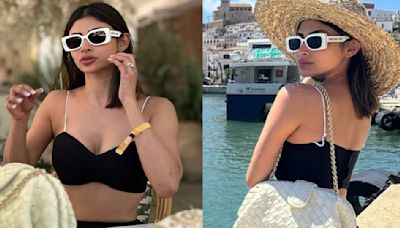 Mouni Roy wears monochromatic skirt-bralette outfit on her vacation in Spain; styles it with cool sunglasses and a hat