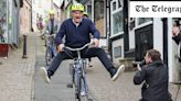 Watch: Ed Davey comically cycles down steep hill in latest Liberal Democrat election stunt
