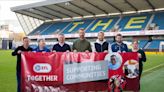 Millwall keep fans’ Premier League dream alive as Championship campaign restarts amid community drive