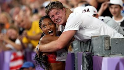 Olympic power couple Tara Davis-Woodhall and Hunter Woodhall celebrate gold medal win