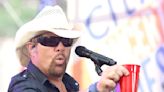 Fans raise a red Solo cup to honor Toby Keith, who immortalized the humble cup in song