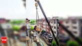 Bull rescued from top of building with crane's help | Kanpur News - Times of India