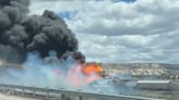 Interstate near Arizona-New Mexico line reopens after train derailment as lingering fuel burns off