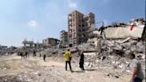 Emergency crews recover bodies in Gaza City as negotiations continue in Egypt