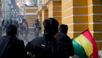 Military flees Bolivia government palace after coup attempt fails, general taken into custody