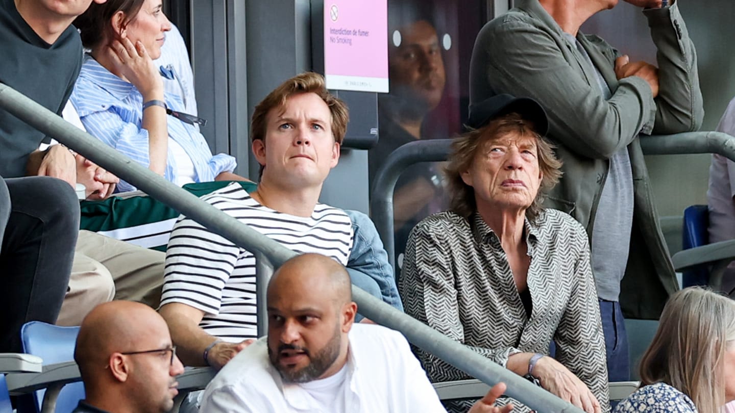 Swimming Rock Star Léon Marchand, Actual Rock Star Mick Jagger Take in Olympic Track