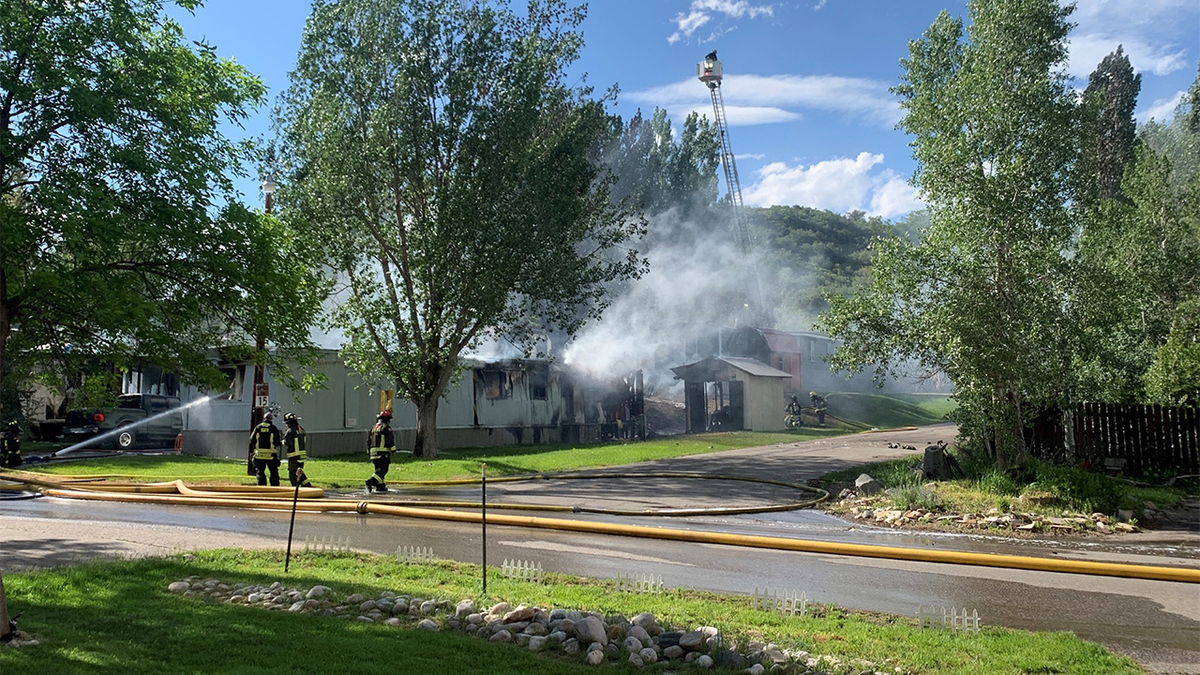 Plane crashes into Colorado mobile home park, setting two trailers ablaze