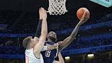U.S. men's basketball team rolls past Serbia 110-84 in opening Olympic game