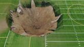 Video shows 100-foot-wide sinkhole open up under soccer field in Illinois