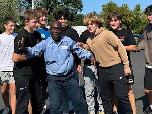 Emotional moment high school janitor receives surprise from students