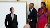 Obamas return to the White House for unveiling of official portraits