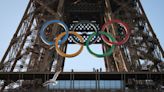 Olympic rings mounted on the Eiffel Tower 50 days ahead of the Summer Games