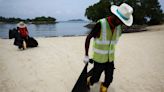 Oil slick closes beaches on Singapore resort island