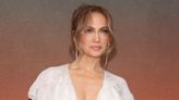 JLo is basically naked on the red carpet wearing just a plunging ruffled robe