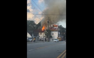 Crews battle blazing fire at historic building, across from where iconic Krispy Kreme burned down