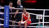 Olympic boxer at center of gender eligibility controversy wins bizarre first bout