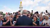 King Charles and Queen Consort walk into palace after being greeted by crowds