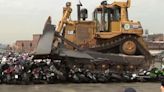 Bulldozer destroys dozens of illegal motorbikes during NYC mayor's press conference