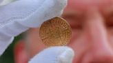 500-year-old gold coins discovered in a German monastery were 'hastily hidden' during a 'dangerous situation'