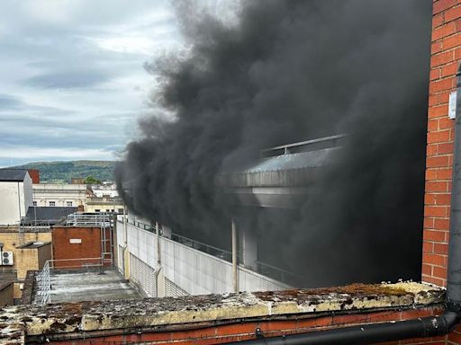 Shopping centre evacuated after car fire