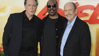 Stars of iconic 1980s movie franchise pose at premiere ahead of upcoming reboot