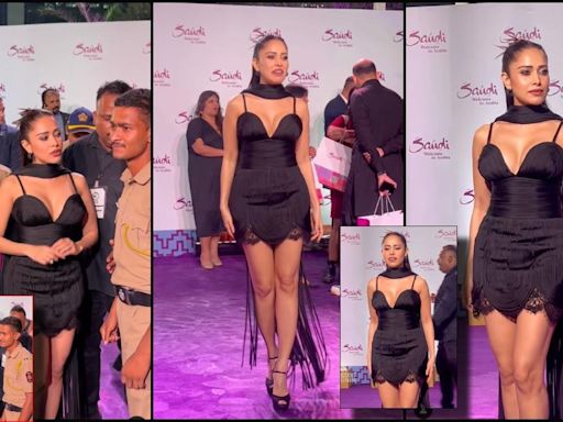 'Vulgar, awful outfit': Nushrratt Bharuccha wears plunging neckline mini black dress with dupatta, poses with policemen at event; trolled