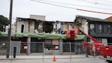 Crews demolish top floor of building on Dundas Street near Kensington Market after its front wall started leaning