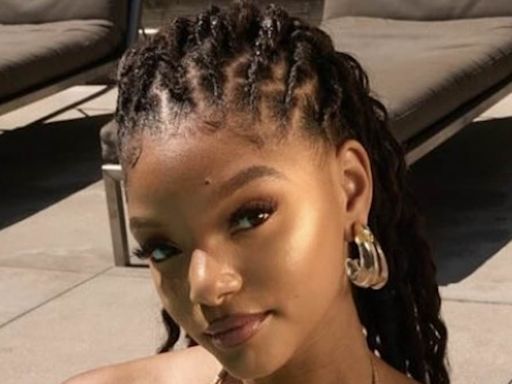 Halle Bailey shows off her incredible figure in a gold bikini