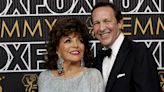 Dame Joan Collins dazzles in flowing sequin gown for the Emmys