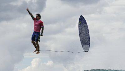 What’s the story behind this insane, viral Olympic surf shot?