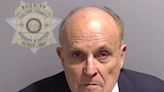 Here's Rudy Giuliani's mugshot, which he said authorities were 'going to degrade themselves' by making him take