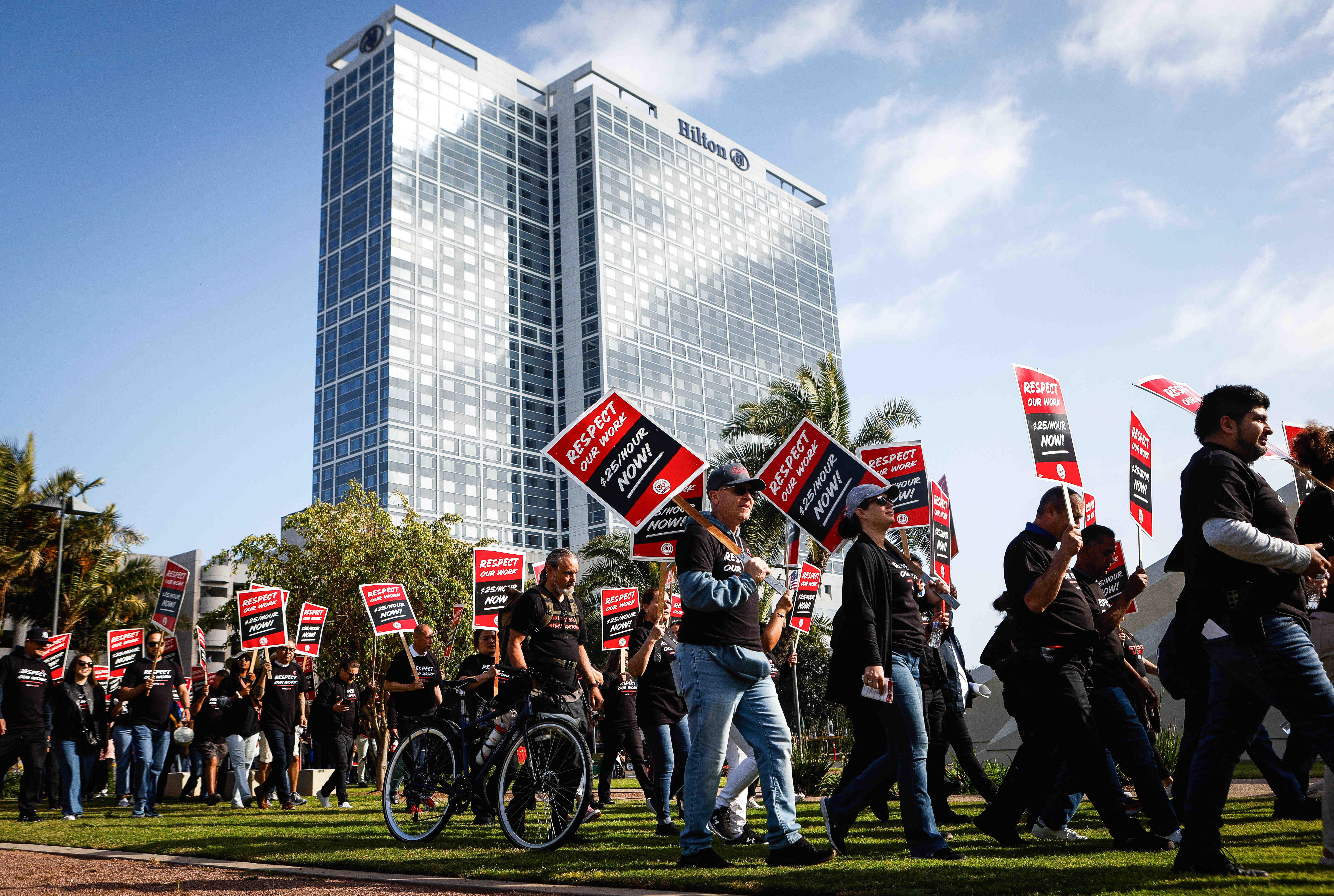 Hundreds of hotel, service workers rally in downtown San Diego for $25-an-hour minimum wage