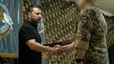 Volodymyr Zelensky presents medals on frontline visit to Ukrainian special forces base