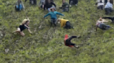 German man defeats man in gorilla costume in annual English cheese-rolling race