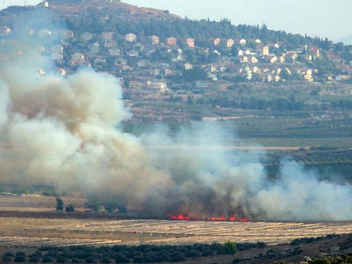 Hezbollah fires rockets, Israel strikes after attack kills Lebanese emergency workers