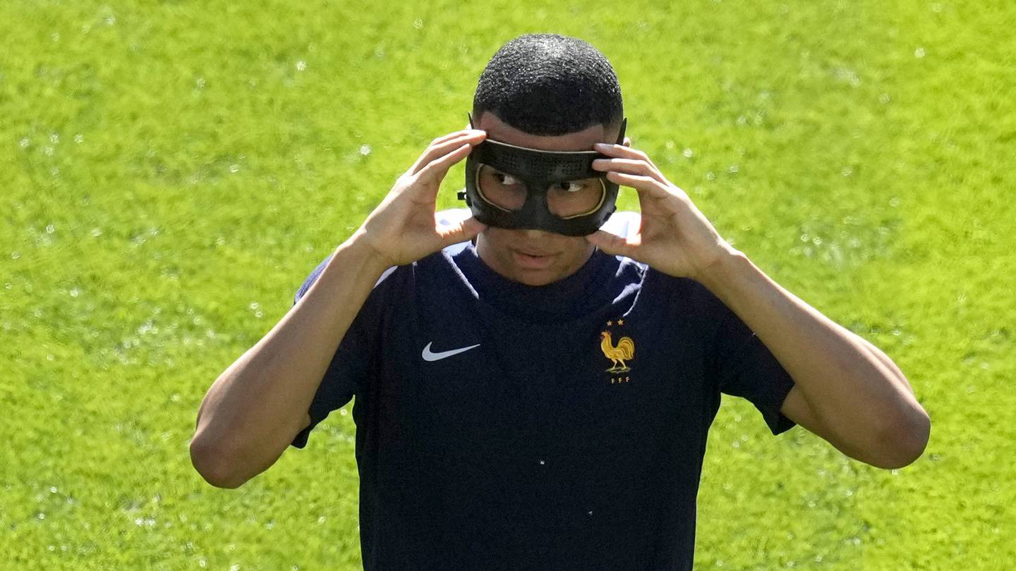 Kylian Mbappé starting for France at Euro 2024 and will wear a mask against Poland