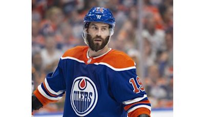 Henrique re-signs with Oilers