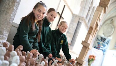 Girl, 11, joins hundreds of pupils making clay sculptures
