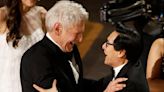 Ke Huy Quan and Harrison Ford’s ‘Indiana Jones’ Awards Season Reunion Concludes With Oscars Hug