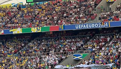 Ukraine supporters unfurl huge mosaic of football-loving soldiers