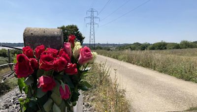 Floral tributes left at scene where dog walker was attacked in village