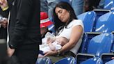 Kyle Walker’s wife Annie Kilner feeds their baby at England’s Euros game