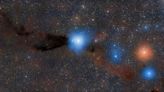 Infant stars burst out of their cosmic cribs in a violent stellar nursery (photo)