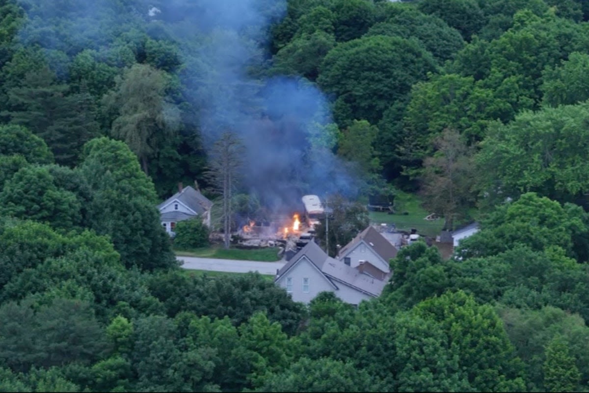 Public warned to stay away amid police standoff with gunman at burning home in Maine