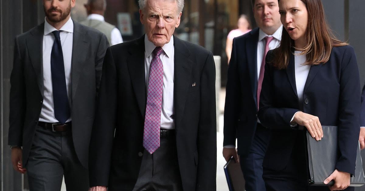 Former Illinois House Speaker Michael...second from left, arrives at the Dirksen U.S. Courthouse in Chicago with his legal defense team on July 16, 2024...